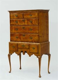 Lot 180: 18th C. Queen Anne figural maple small size two-part highboy with cornice molded top - upper case with five drawers - lower case with three drawers - shaped apron on cabriole legs on pad feet, ca.1760, 37"W. x 63"H. x 19"D.