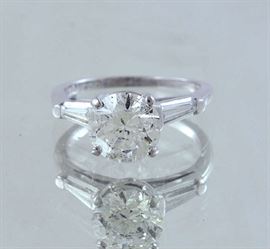 Lot 183: Platinum and diamond ring, 2.07 ct round diamond with two tapered baguettes, approx. .44 ctw, size 5.5