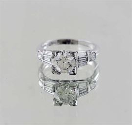 Lot 191: Platinum and diamond ring, round cut diamond 1.37 ct with six baguette diamonds and two round diamonds, approx. .60 ct, size 7