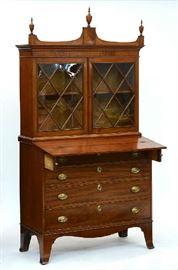 Lot 195: Federal two-part mahogany secretary with two glass doors - fall front lid writing surface and four graduated drawers on French feet ca.1820, 40"W. x 70"H. x 18"D.