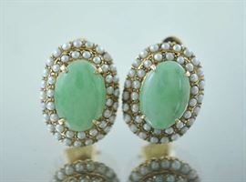 Lot 201: Pair of 14k yellow gold ear clips oval green jade surrounded with pearls,\jade measures 11.8mm x 15.9 mm- 19 grams