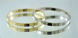 Lot 229: Two Cartier 18k gold love bracelets white and yellow gold, on choice both signed and authentic