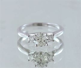 Lot 236: 14k white gold three stone diamond ring, center stone approx. .80 ct (vs I-H)
