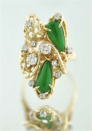 Lot 241: 14k yellow gold diamond and green jade ring, 10.1 grams