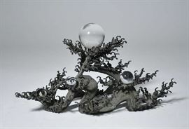 Lot 244: 19th C. Japanese bronze stand, waves holding five crystal balls, 15"L. x 8.5"H.