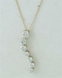 Lot 276: 14k gold and diamond pendant on chain