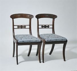 Lot 275: Set of six brass inlaid Regency mahogany dining chairs with saber legs