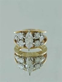 Lot 326: 14k yellow gold ring, approx. .80 ct marquise cut diamond with another approx. 1 ctw of round and other diamonds