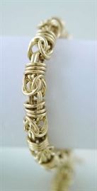 Lot 414: 14k gold bracelet signed T.L., 26 grams, 7"L.