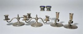 Lot 446: Tiffany and Co. sterling candlesticks, Georg Jensen salts along with a pair of sterling candelabras