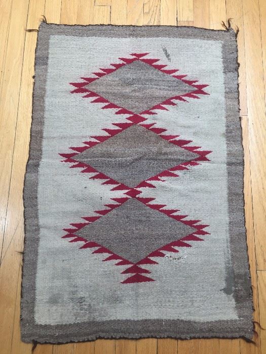 Large collection of Navajo rugs dating from late 1800's to mid century, including "dazzler" and "pictorial" rugs, some with authentication certificates
