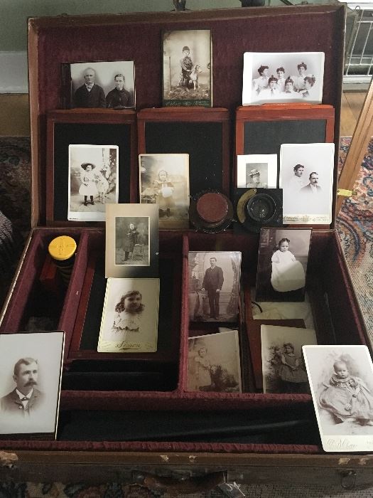 This suitcase isn't just a photo display, although these early prints (some from Cripple Creek Colorado) are terrific- but the entire Comley Camera set up ant tripod fit within.  Amazing piece of history.