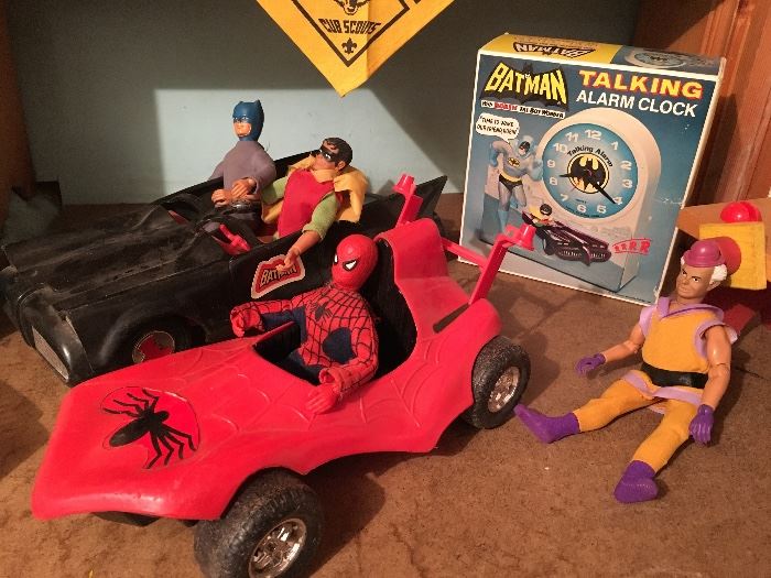 Bat Man and Spider Man are ready to race, but Robin insists on driving.