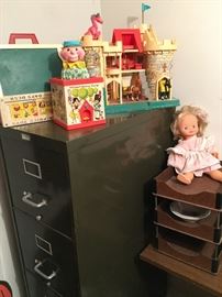 Some fun Fisher Price toys and older file cabinet that works great