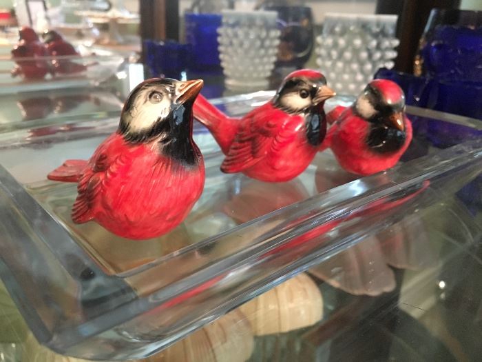 These three little birds enjoy a  crystal tray 