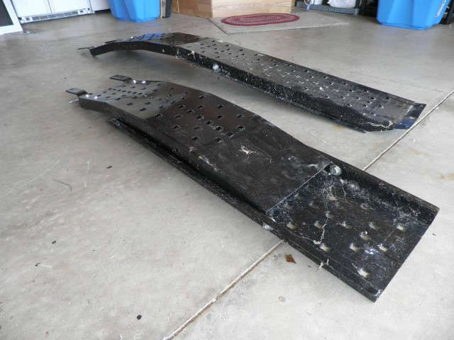 T_1.JPG	Description:: Ohio Steel Industries presents Premium Steel Loading Ramps feature a solid all-steel design with a punched tread pattern for superior traction over rung-style ramps. Patented overlapping hinges provide added structural support, allowing for a high load capacity of 2,000 lbs. of distributed weight per set.
Condition:: Used with some minor dents.
Size/weight:: 89x15in. LW
Shipping:: NO SHIPPING!!!