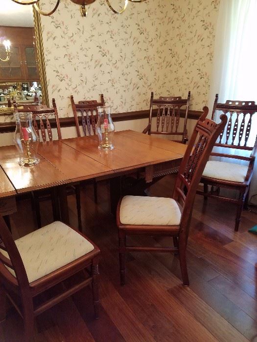 Gorgeous and unusual Antique dining room table and very unusual antique chairs