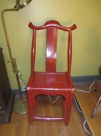Heavy lacquered oriental chair painted oriental red.
