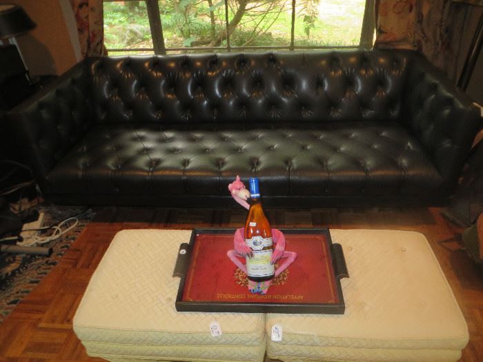 Black tufted retro leather sofa.