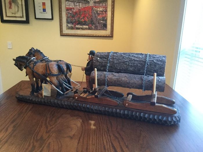 Hand carved logger and his team of horses