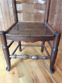 These 4 chairs are a 1800's Victorian era Antique. Lovely ladder back design with solid wood structure. Chairs are structurally sound with aging marks. .