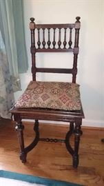 Hand carved antique chair with brass bolts. Comes with the chair pad