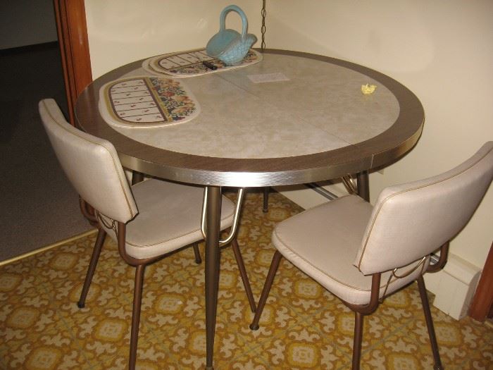 Vintage kitchen table with two chairs.