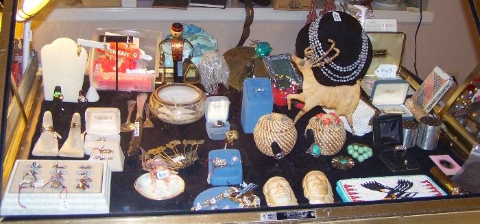 Costume jewelry, Coushatta coiled pine needle baskets, Coushatta wild Figure,  Frankoma Masks, vintage Phillip Morris Cigarette holder, Glass Pink Elephant, Swarovski Jewelry and more to come!