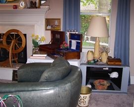 Thayer Coggin leather club chairs, Ashford Spinning Wheel, Silverplate flatware, Vintage pottery Lamp, swivel TV Stand with glass doors included