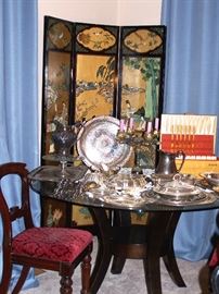 3 panel Asian screen, carved and painted, Antique wood chairs with cut velvet upholstered seats, Glass-top round dining table on wood base, Silverplate serving, Gold plated flatware set.
