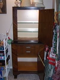 Deco medical Cabinet, lighted top section with glass shelves. Light goes off when door closes.  Metal drawers,  Wood shelf in lower section.