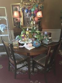 Easter and spring décor atop this solid wood table and four chairs. Note the medallion on the rug beneath! Lamps can be more closely seen in other photo...            ( NO PRICE QUOTES  AND NO HOLDS SO PLEASE DON'T ASK :-))