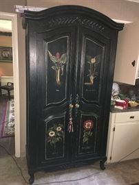 Outstanding hand-painted floral two-door, black armoire. This kind of a piece can actually "make" a room. Remember, every room should have some black in it! ( NO PRICE QUOTES  AND NO HOLDS SO PLEASE DON'T ASK :-))