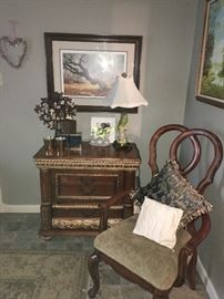 Amazing hand-carved twisted "heart" arm chair!! Small chest with porcelain parrot lamp and silk shade. Gnarled tree painting is hung above. ( NO PRICE QUOTES  AND NO HOLDS SO PLEASE DON'T ASK :-))