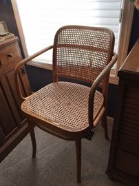 2 Vintage Polish bentwood chairs with cane seats and backs.