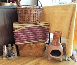 Vintage picnic baskets, chiminea, terra cotta statues
