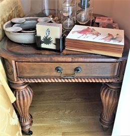 Ornate wood end table with drawer, oil lamps, pottery centerpiece candle holder bowl