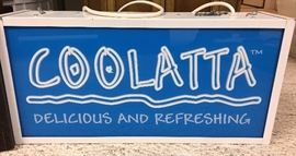Illuminated COOLATTA advertising sign.