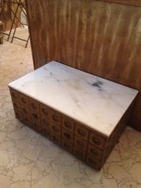 #122 Gold cabinet w marble top w doors $75