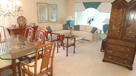 Main room with sofa set, bar armoire, Thomasville dining room and club chairs