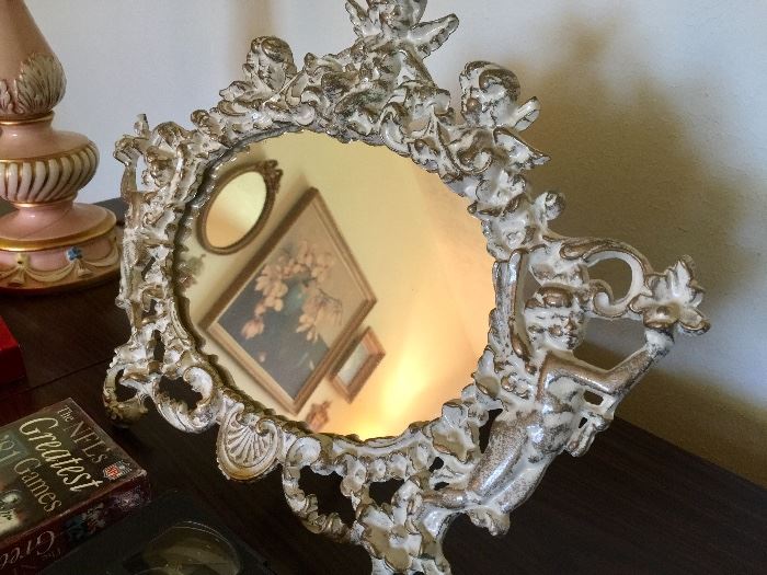 One of several decorative mirrors throughout house