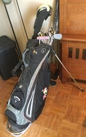 one of 4 sets of nice golf clubs and bags