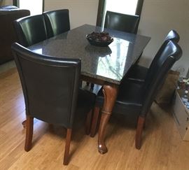 marble top dining table and 6 leather chairs (sold separately)