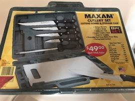 New in packaging Maxam cutlery set with cutting board and storage case. Eight piece set.