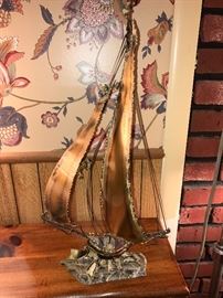 Metal & stone base boat.