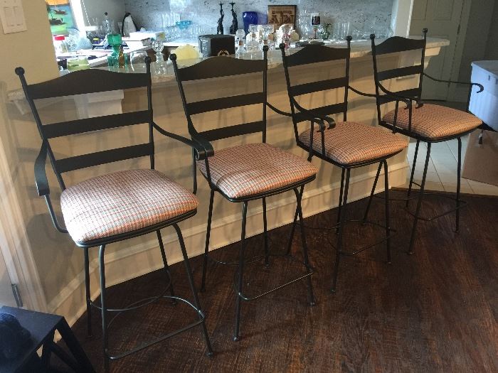 4 black wrought iron bar stools with upholstered seats