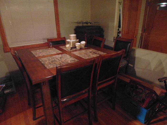 Wood and granite table with 6 leather seated chairs