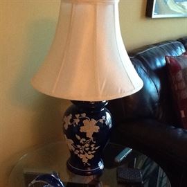 Two antique lamps. Cobalt blue with cream floral pattern in relief. $50 for both.