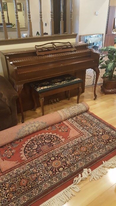Piano and large Karastan Rug.