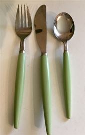 Large set of these patina green vintage place settings. 